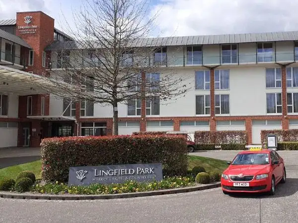 Lingfield-Park front view and a red color taxi